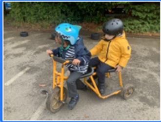 Young children on tandem trike