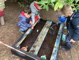 image of children watering plants