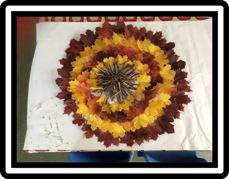 child's Sunflower composition of leaves and twigs