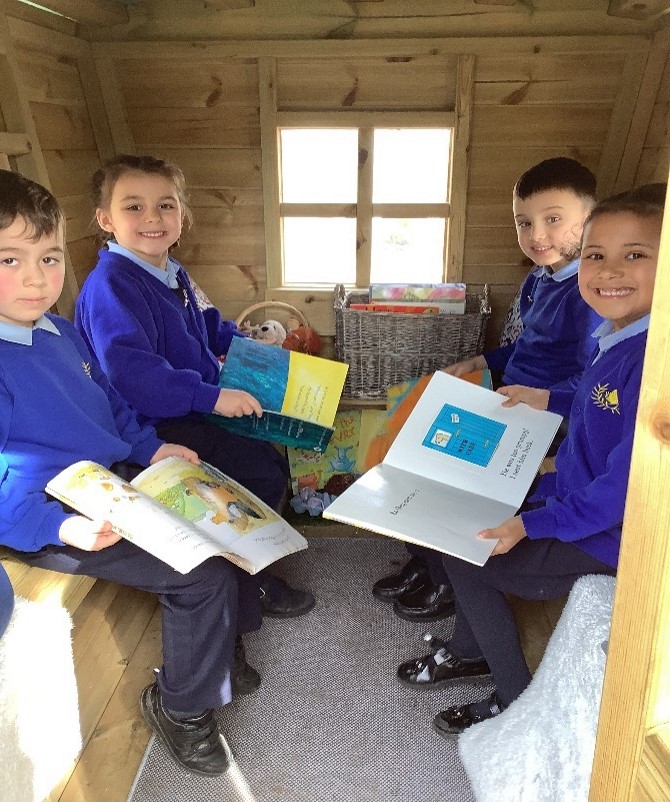 reading caravan interior with pupils reading