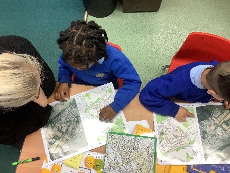 Image of children reading maps